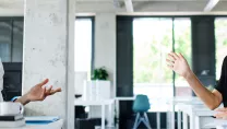 Two co-workers talking in an office