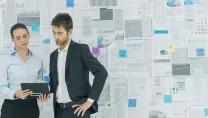 Two people studying a clipboard